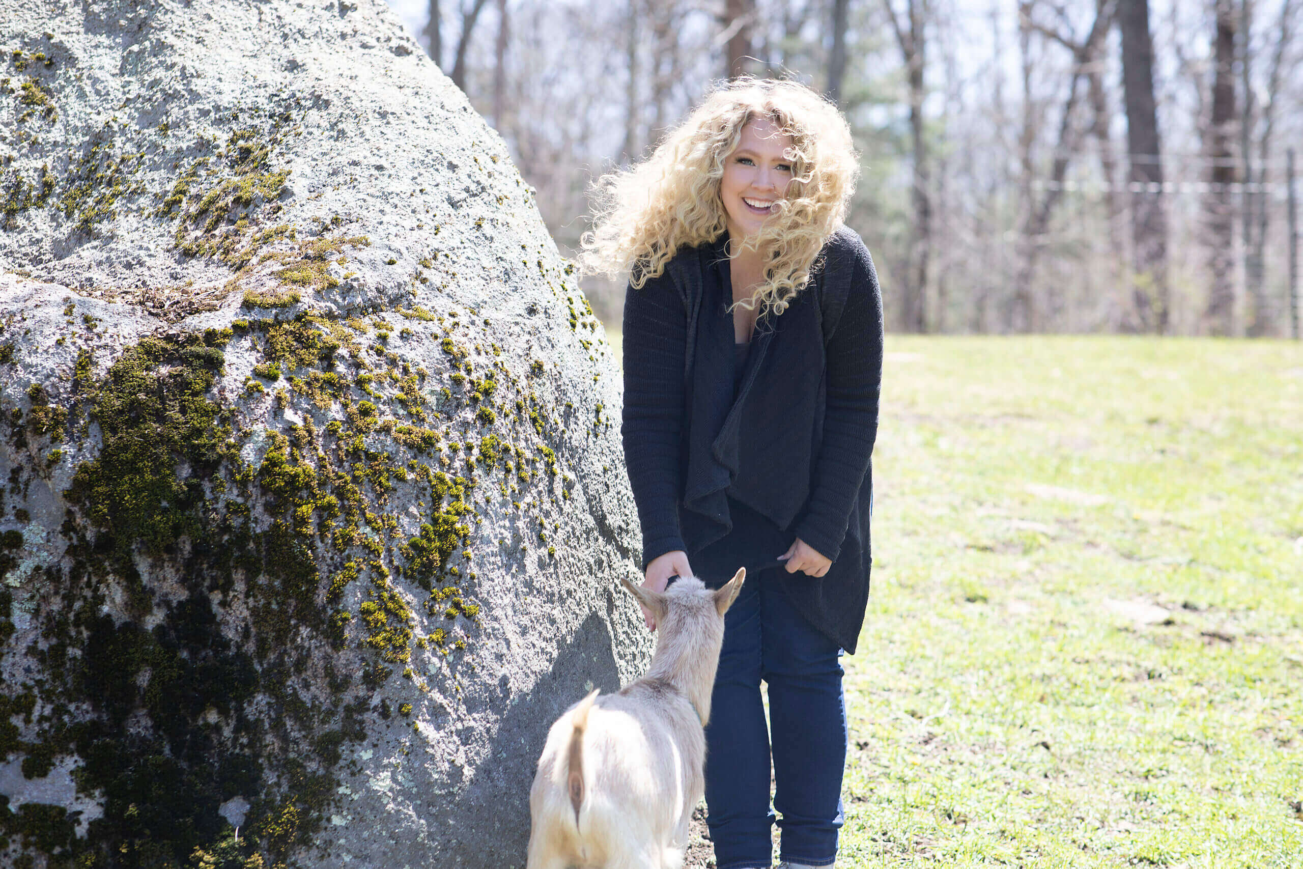 Julie Chenell on Longwater Farm with a baby goat